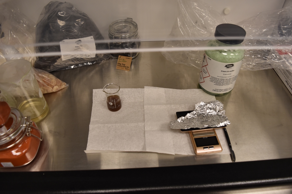 Weighing the ingredients for the synthesis of iron gall under the fume hood.
